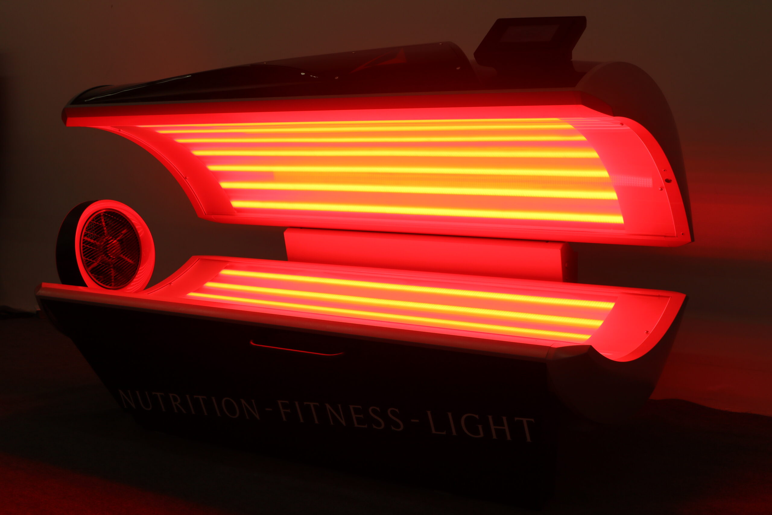 Prism Light Pod red and near-infrared light panels glowing during a photobiomodulation session