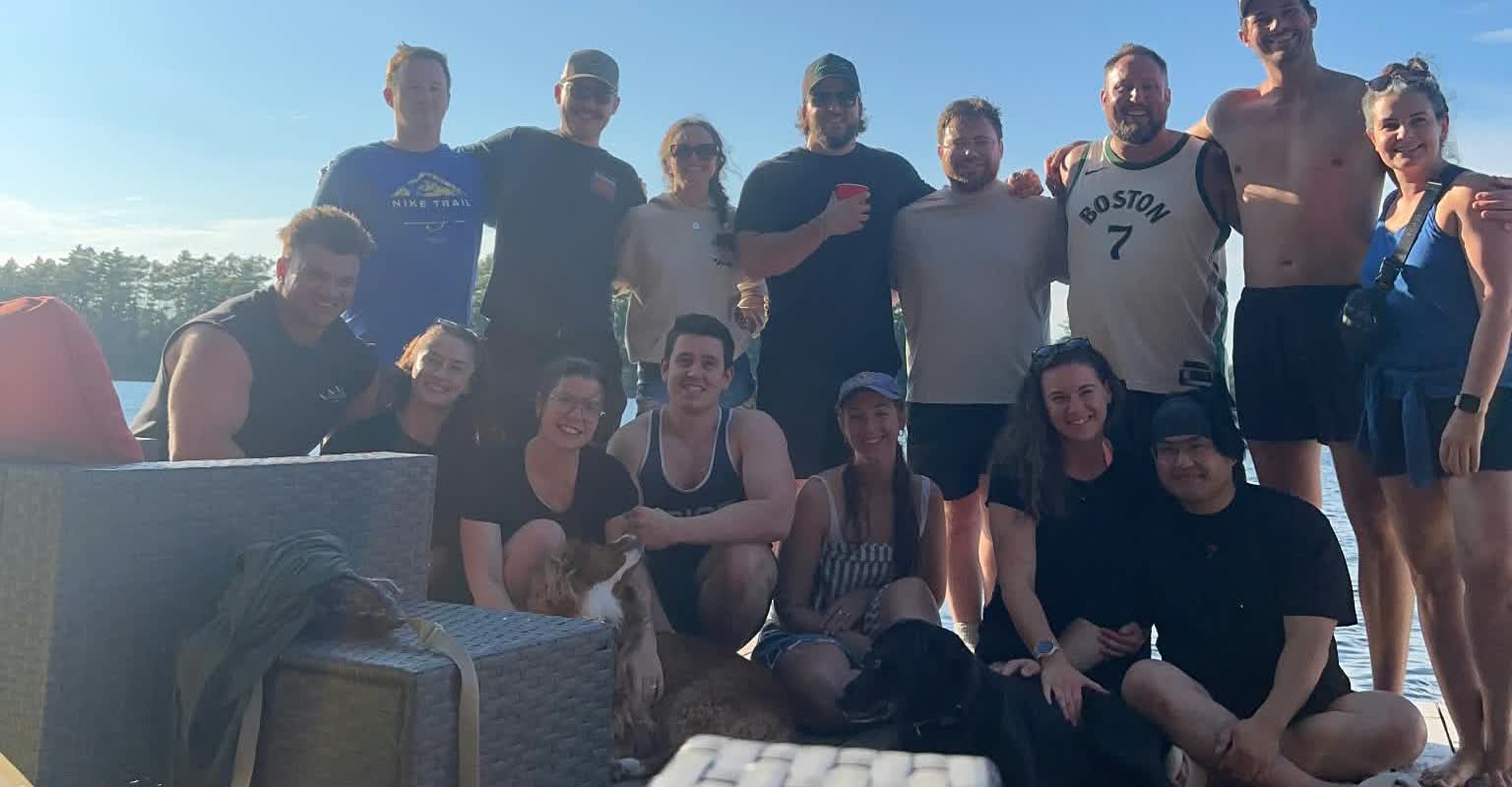 Nobility Performance practitioners and staff at a team social by the lake